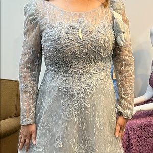 brand new Long sleeve maxi gown beaded silver color. Size 16